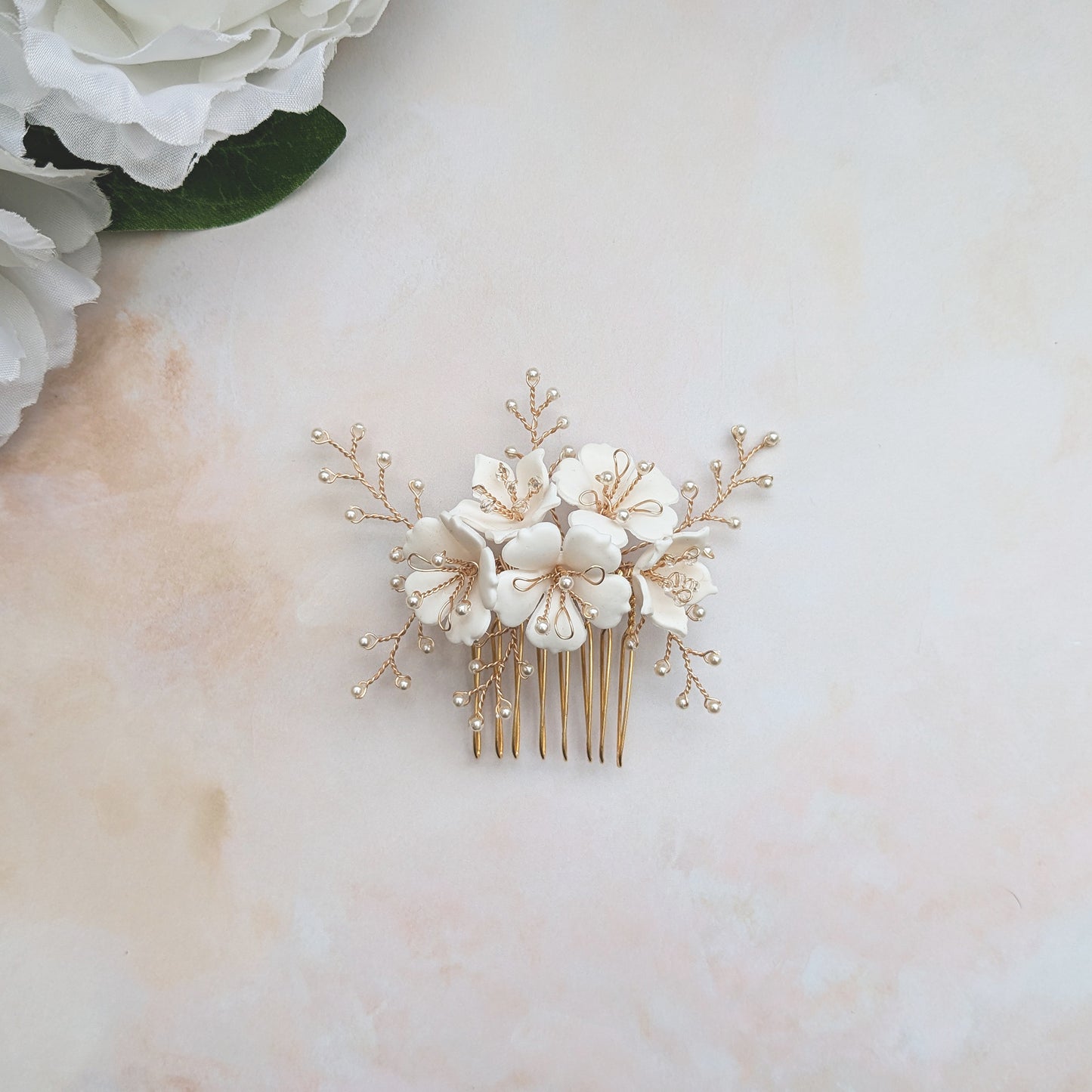 Modern hand sculpted floral hair comb designed & handmade by Susie Warner.