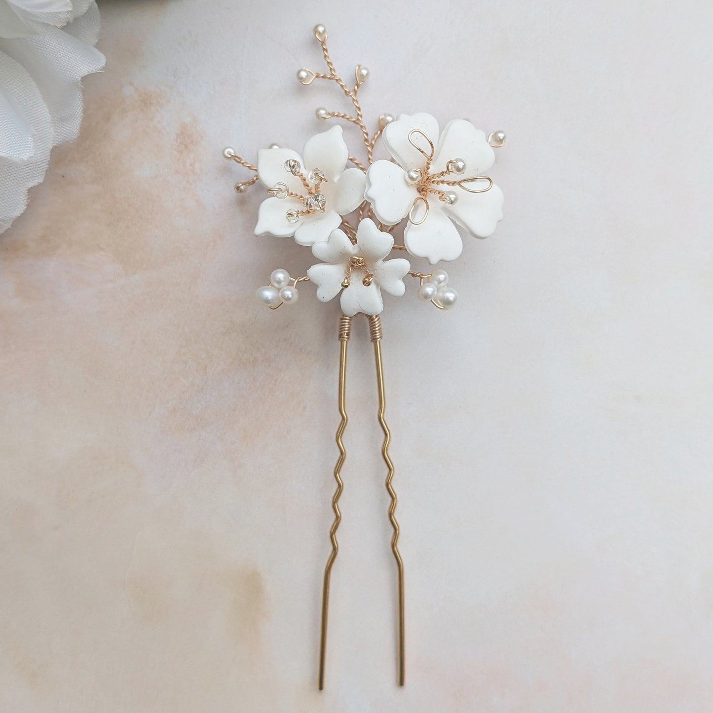 Detail of statement floral hair pins for brides designed & handmade by Susie Warner.