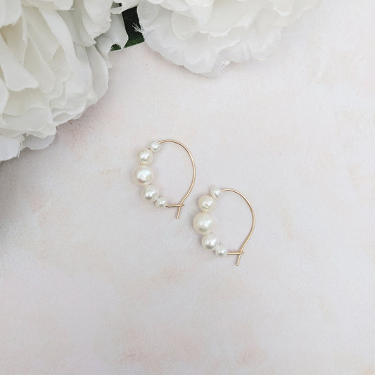 Statement gold pearl hoop earrings for brides designed & handmade by Susie Warner.