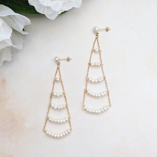 Statement gold pearl chandelier earrings designed & handmade by Susie Warner.