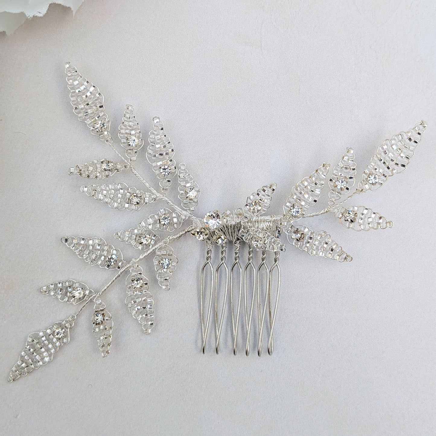 Nature inspired bridal hair comb with beaded leaves designed & handmade by Susie Warner.