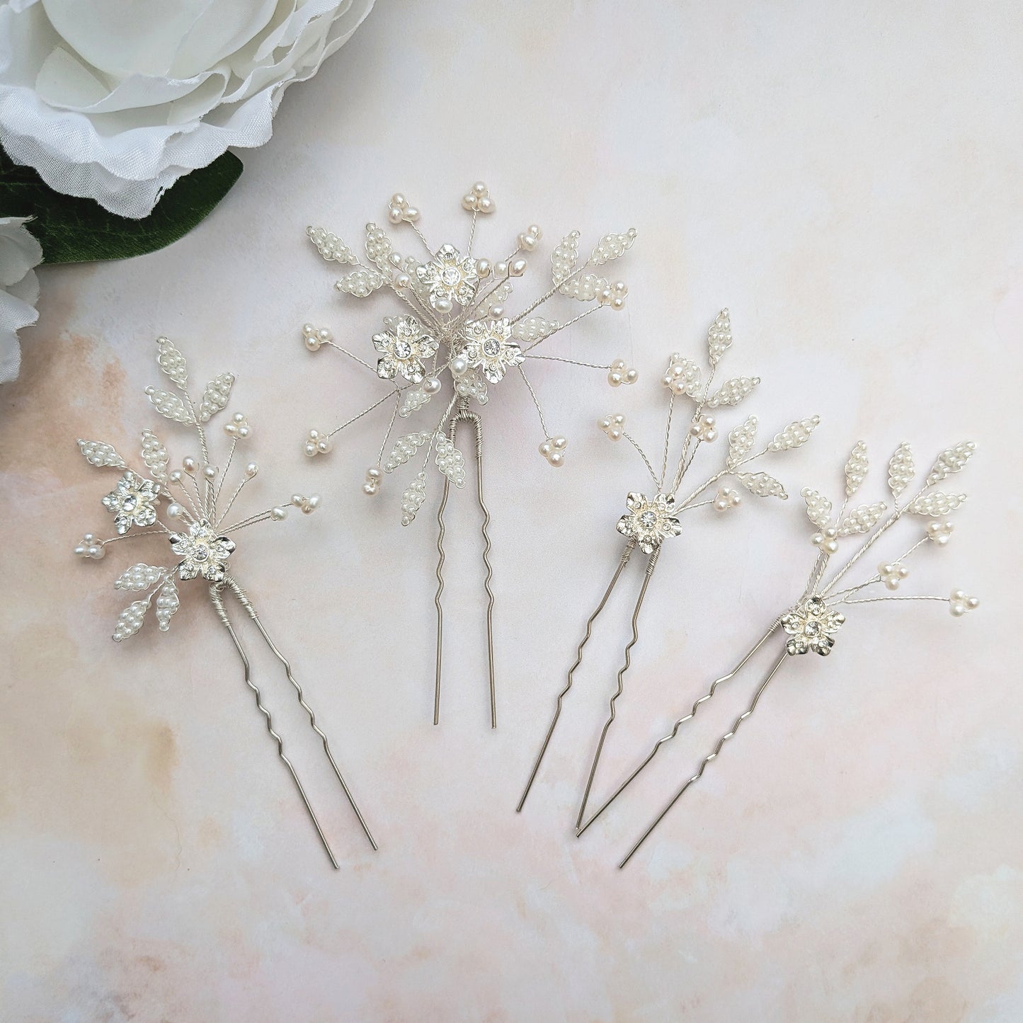 Statement modern floral hair pins for brides designed & handmade by Susie Warner.
