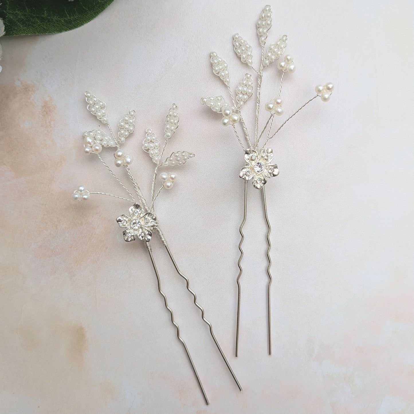 Small floral hair pins for brides with crystal & pearl leaves designed & handmade by Susie Warner.