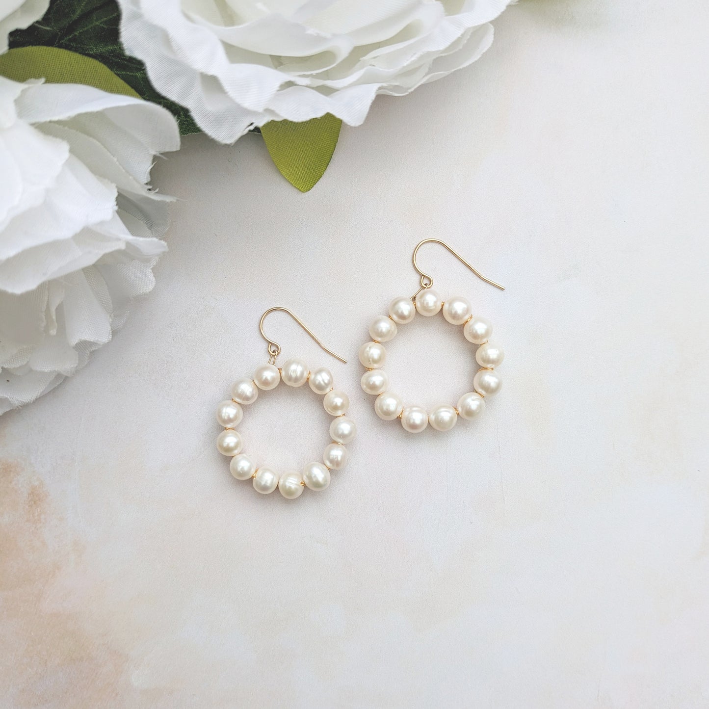 Statement front facing pearl hoop earrings for brides designed & handmade by Susie Warner.