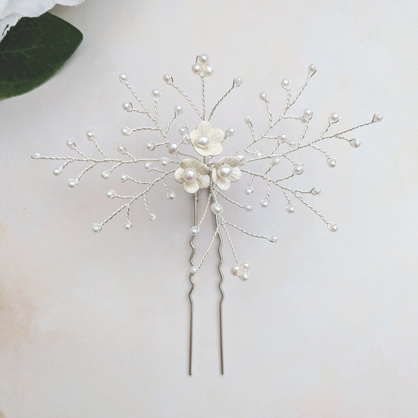 Statement large white floral hair pin for weddings designed & handmade by Susie Warner.