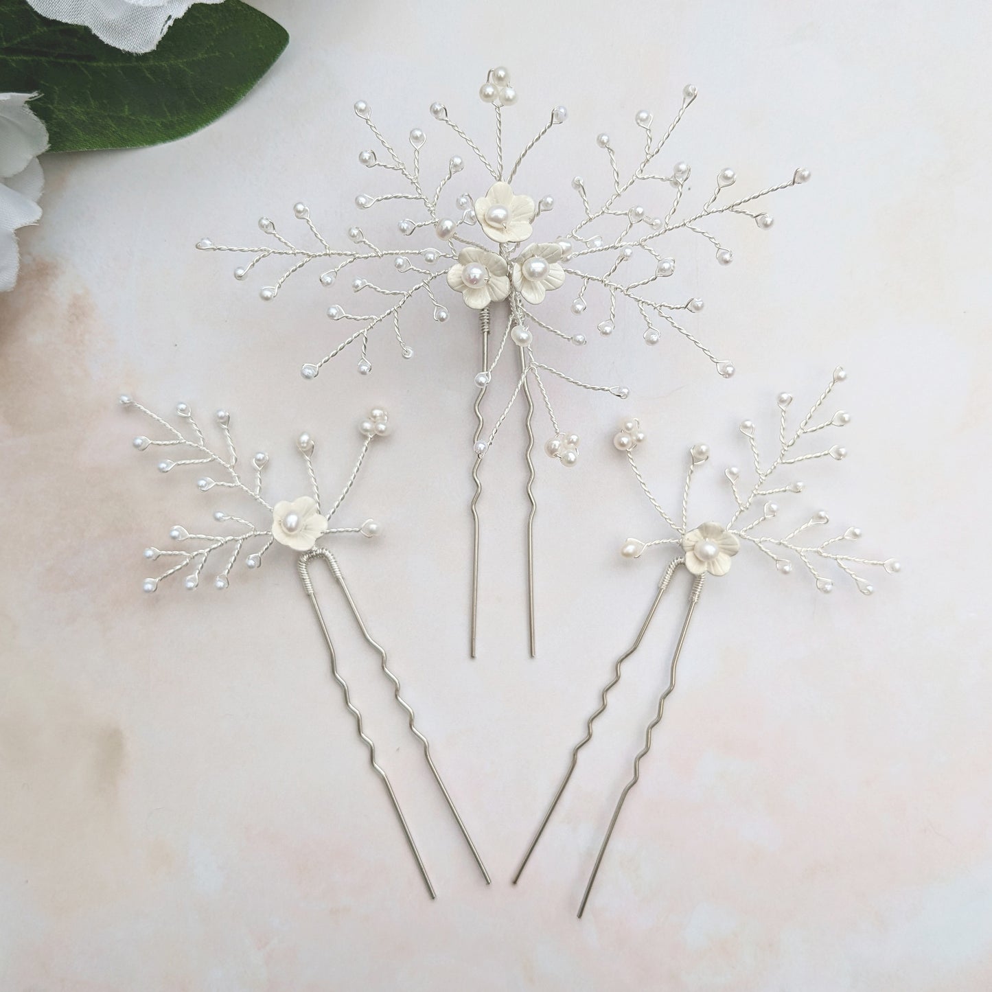 Statement white floral hair pins for brides designed & handmade by Susie Warner.