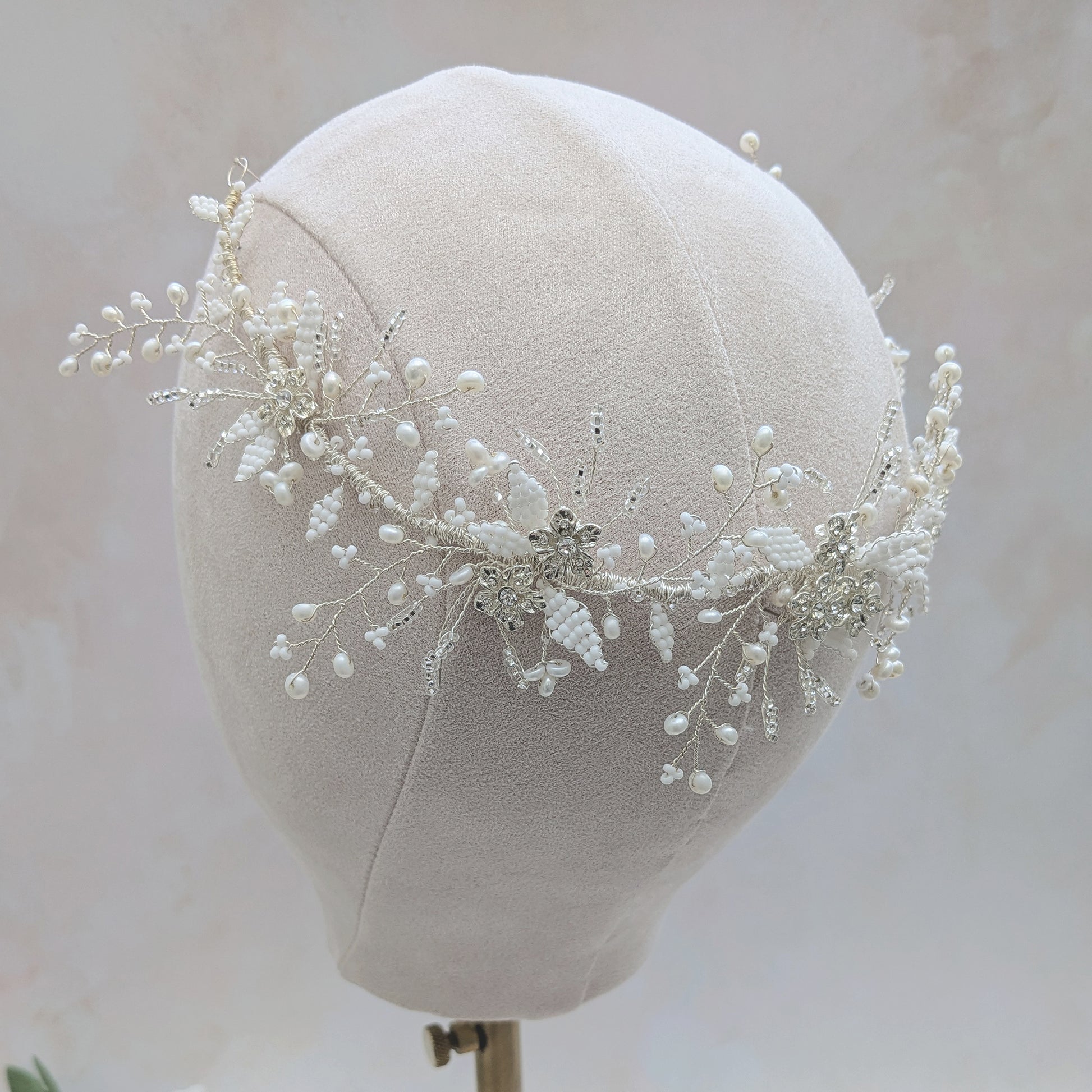 Silver floral hair vine headpiece worn at the back of the head designed & handmade by Susie Warner.