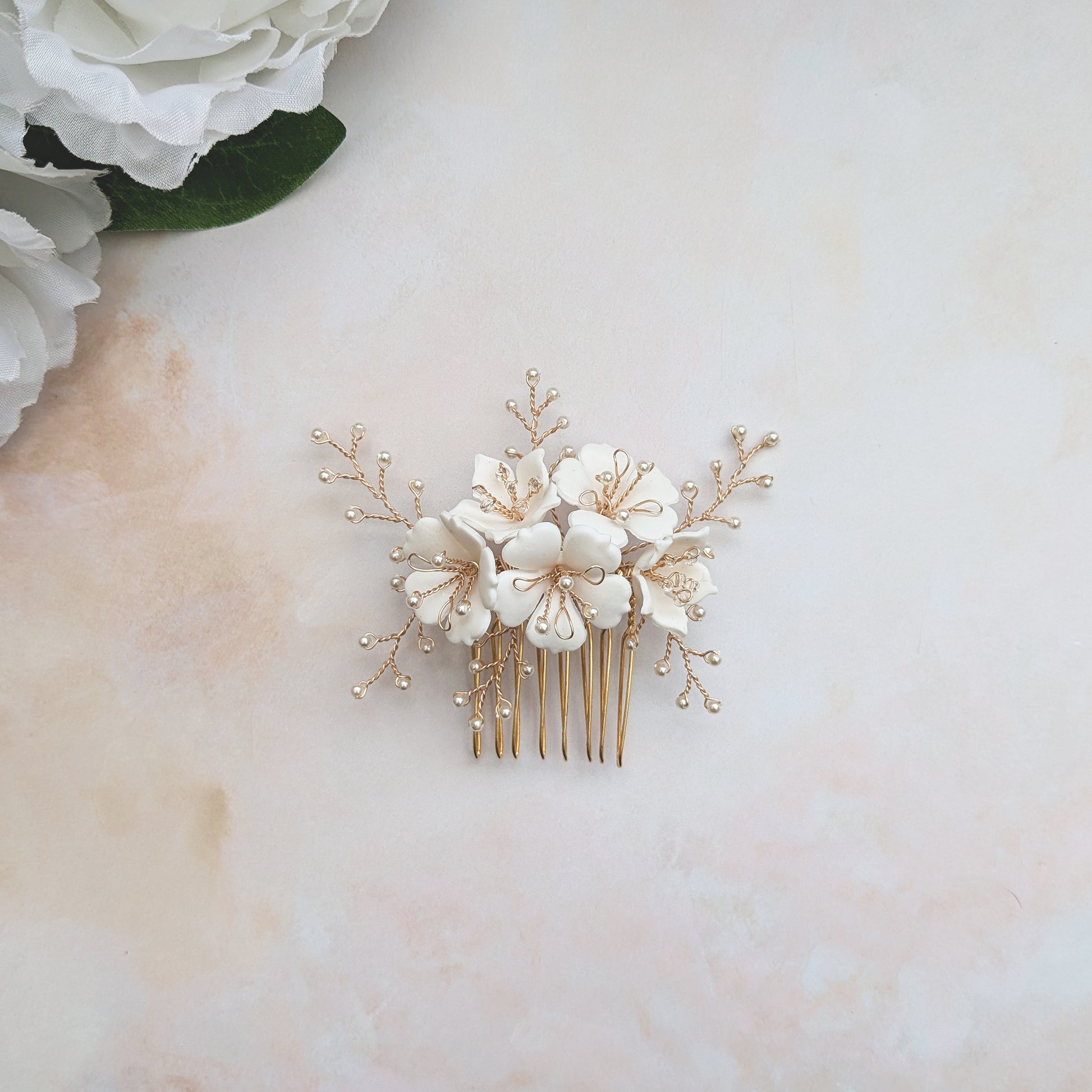 Modern hand sculpted floral hair comb designed & handmade by  Susie Warner.