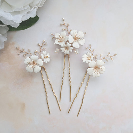 Statement hand sculpted floral hair pins for weddings designed & handmade by Susie Warner.