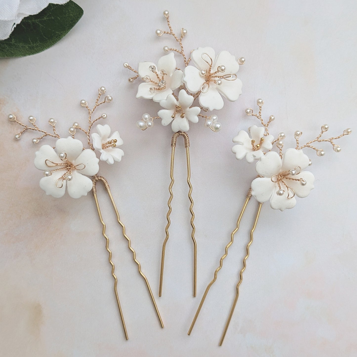 Statement floral hair pins for brides designed & handmade by Susie Warner.