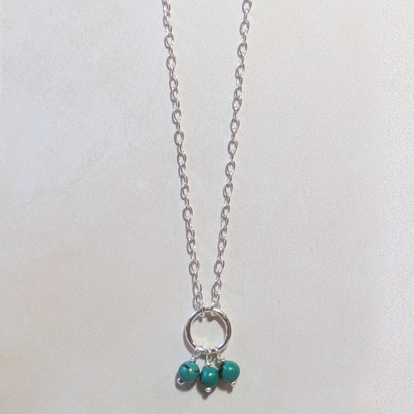 Necklace with Turquoise beads on a white background.
