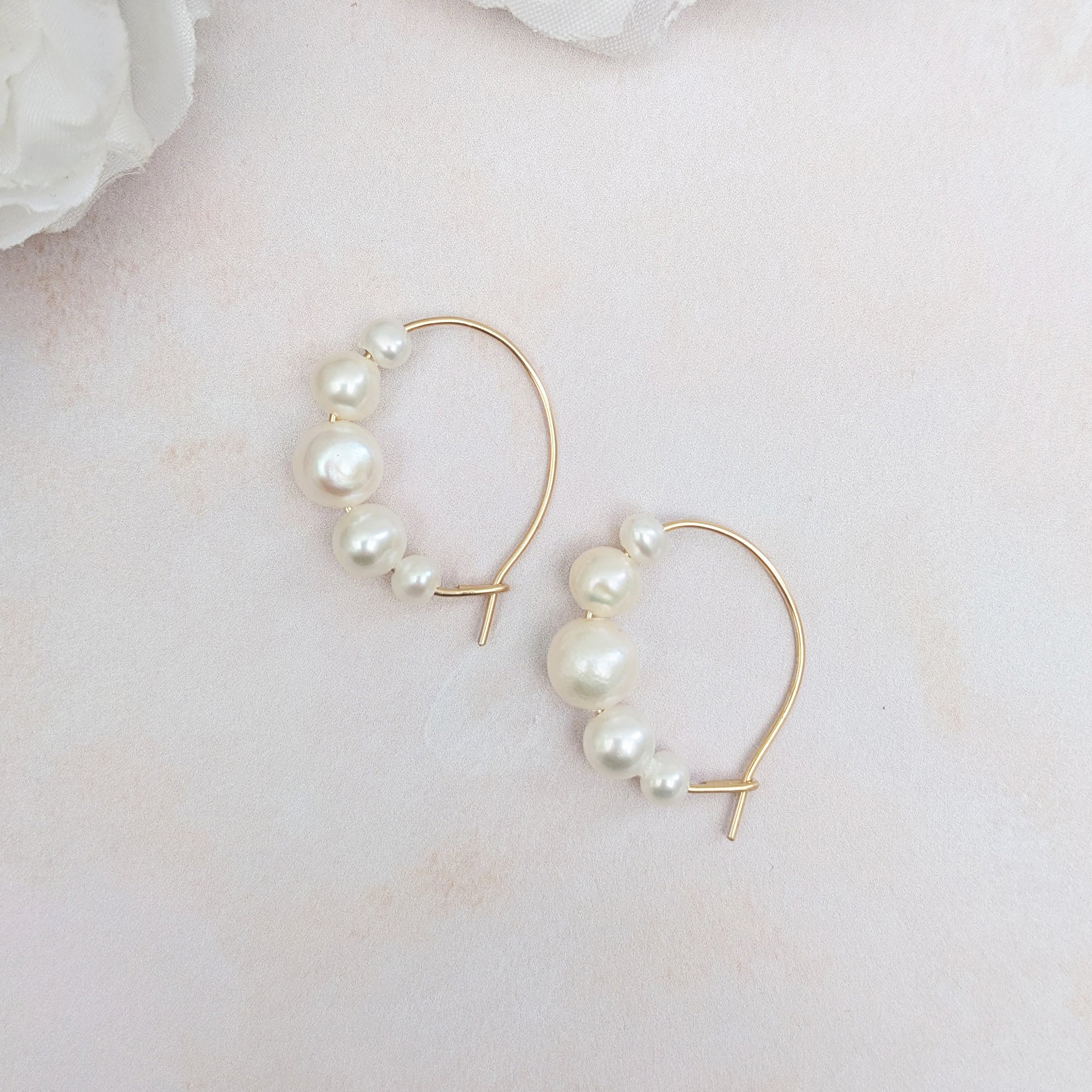 Statement graduated pearl hoop earrings for brides designed & handmade by Susie Warner.