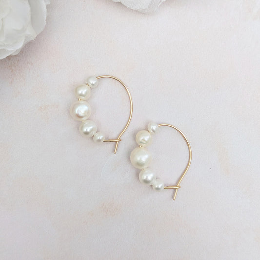 Statement graduated pearl hoop earrings for brides designed & handmade by Susie Warner.