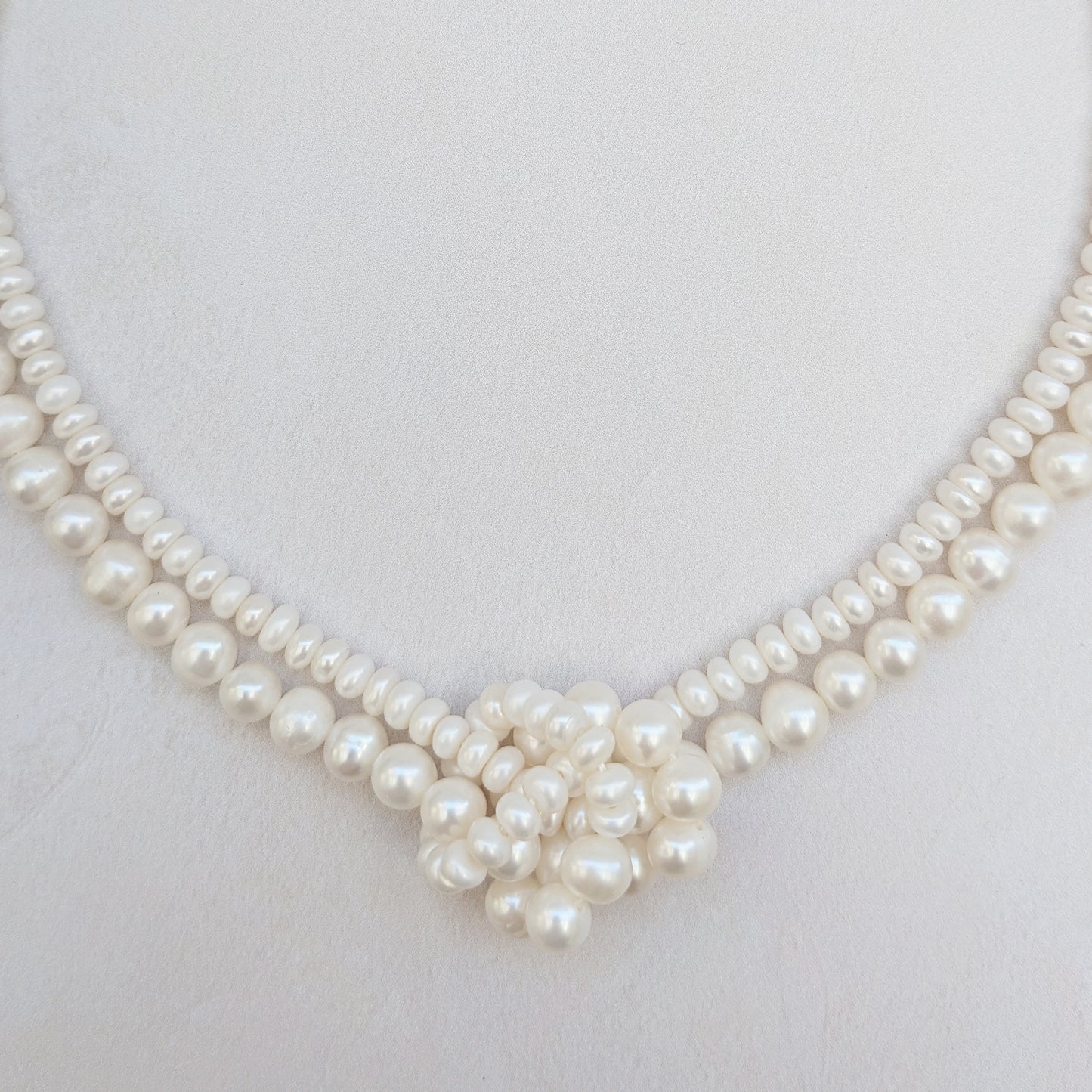 Detail of statement pearl knot necklace for brides designed & handmade by Susie Warner.