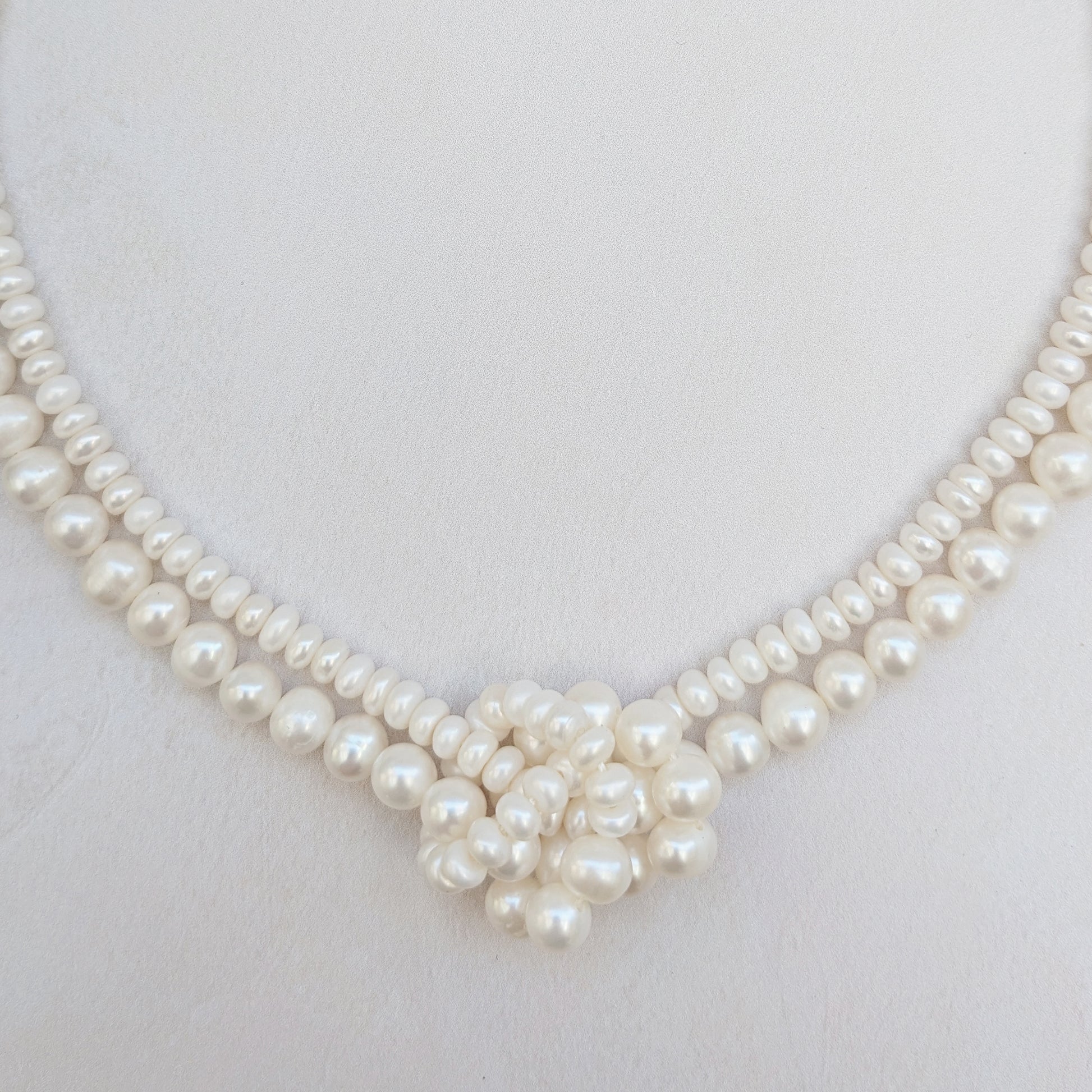 Detail of statement pearl knot necklace for brides designed & handmade by Susie Warner.