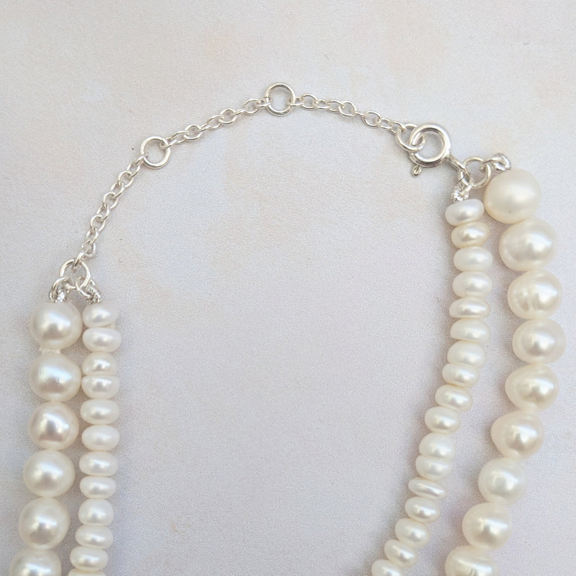 Adjustable statement pearl knot necklace for brides designed & handmade by Susie Warner.
