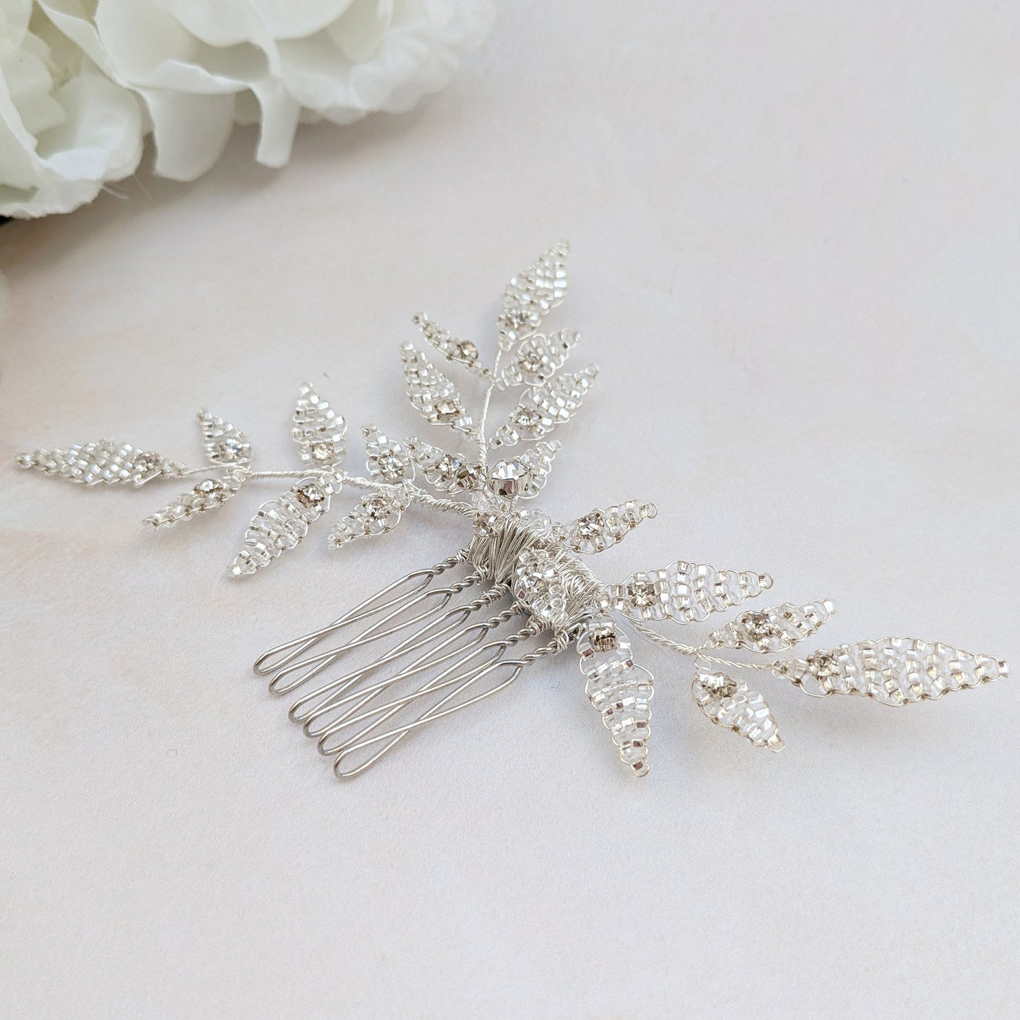 Detail of nature inspired bridal hair comb with silver beaded leaves designed & handmade by Susie Warner.