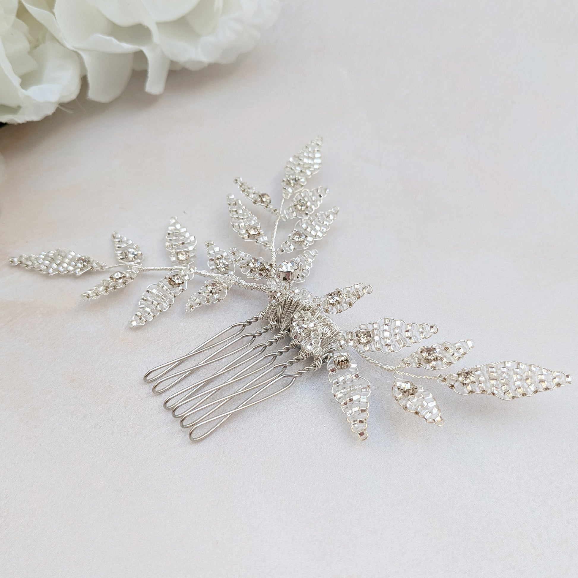 Detail of nature inspired bridal hair comb with silver beaded leaves designed & handmade by Susie Warner.