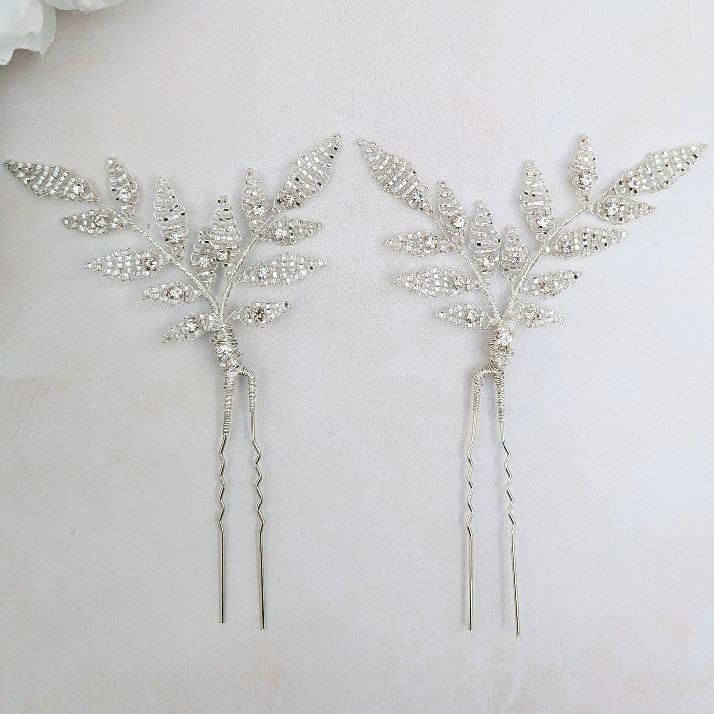 Modern silver leaf hair pins inspired by nature for brides designed & handmade by Susie Warner.