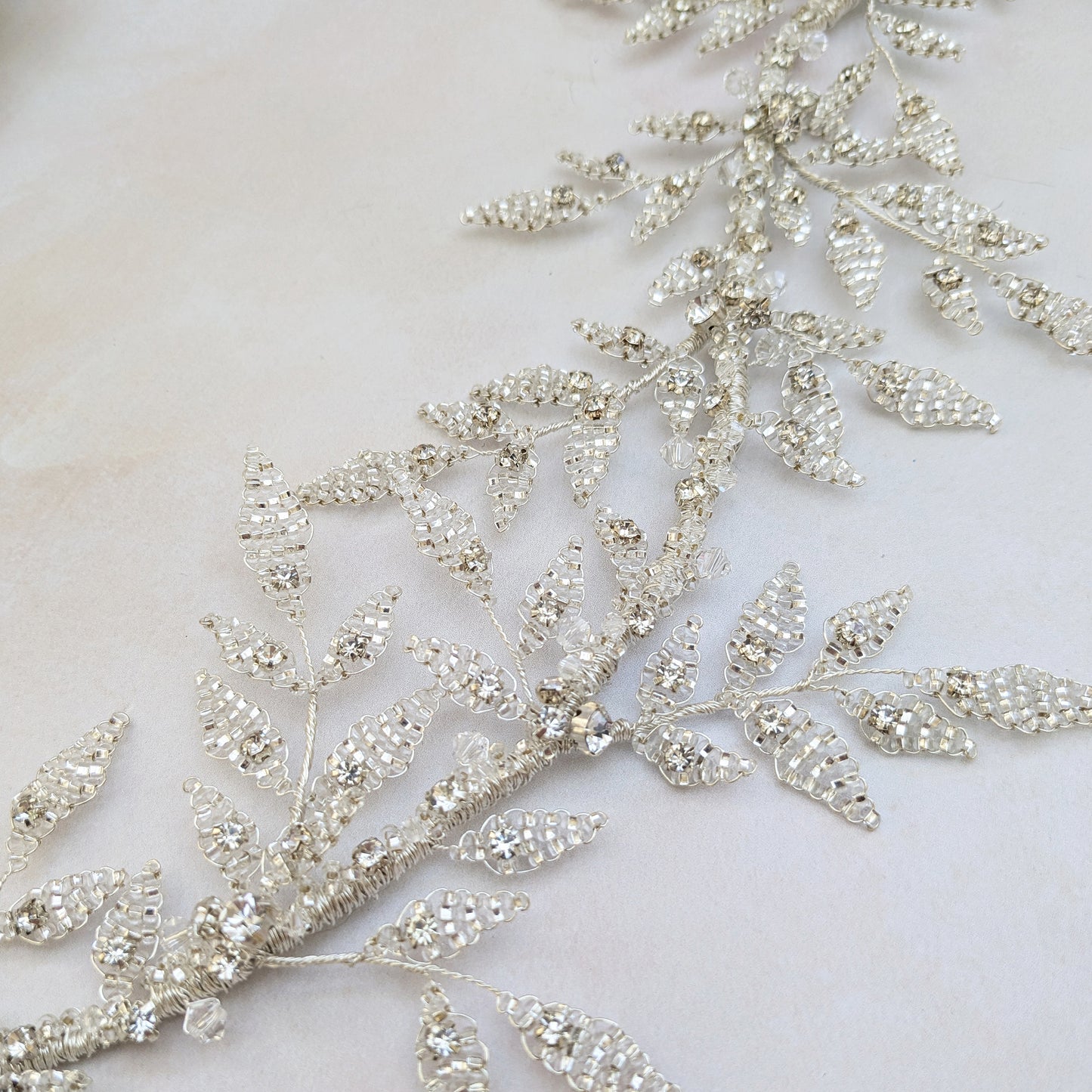 Botanical silver leaf hairpiece for modern nature inspired brides designed & handmade by Susie Warner.