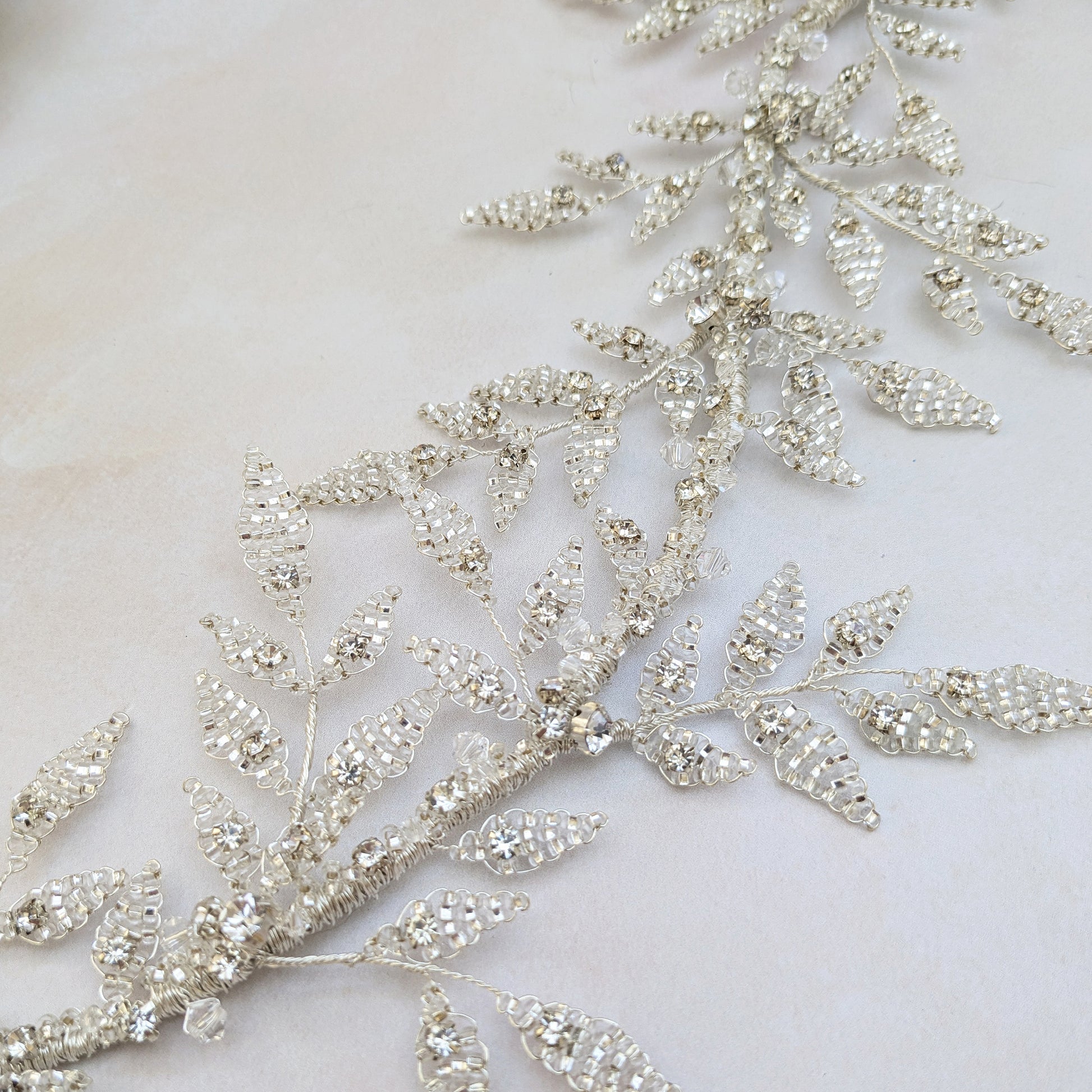 Botanical silver leaf hairpiece for modern nature inspired brides designed & handmade by Susie Warner.