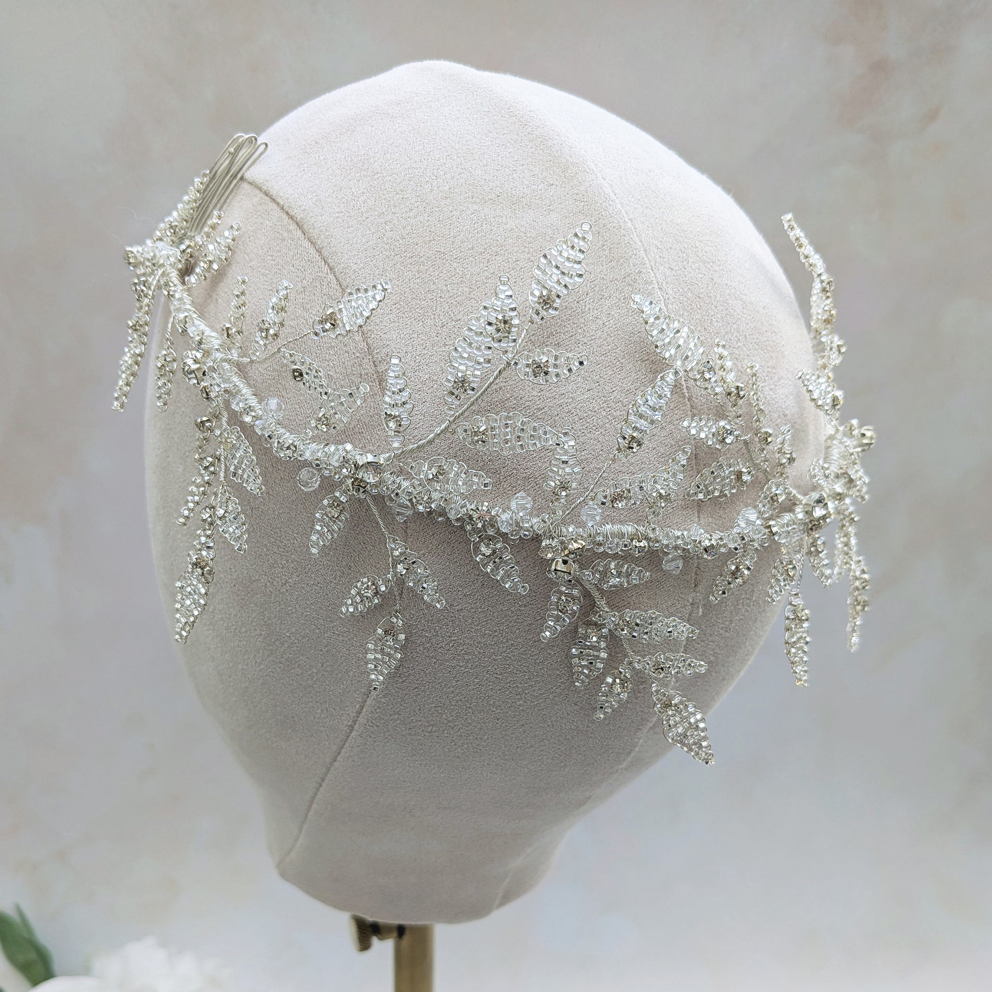 Botanical silver leaf headpiece worn at the back of the head for modern brides designed & handmade by Susie Warner.