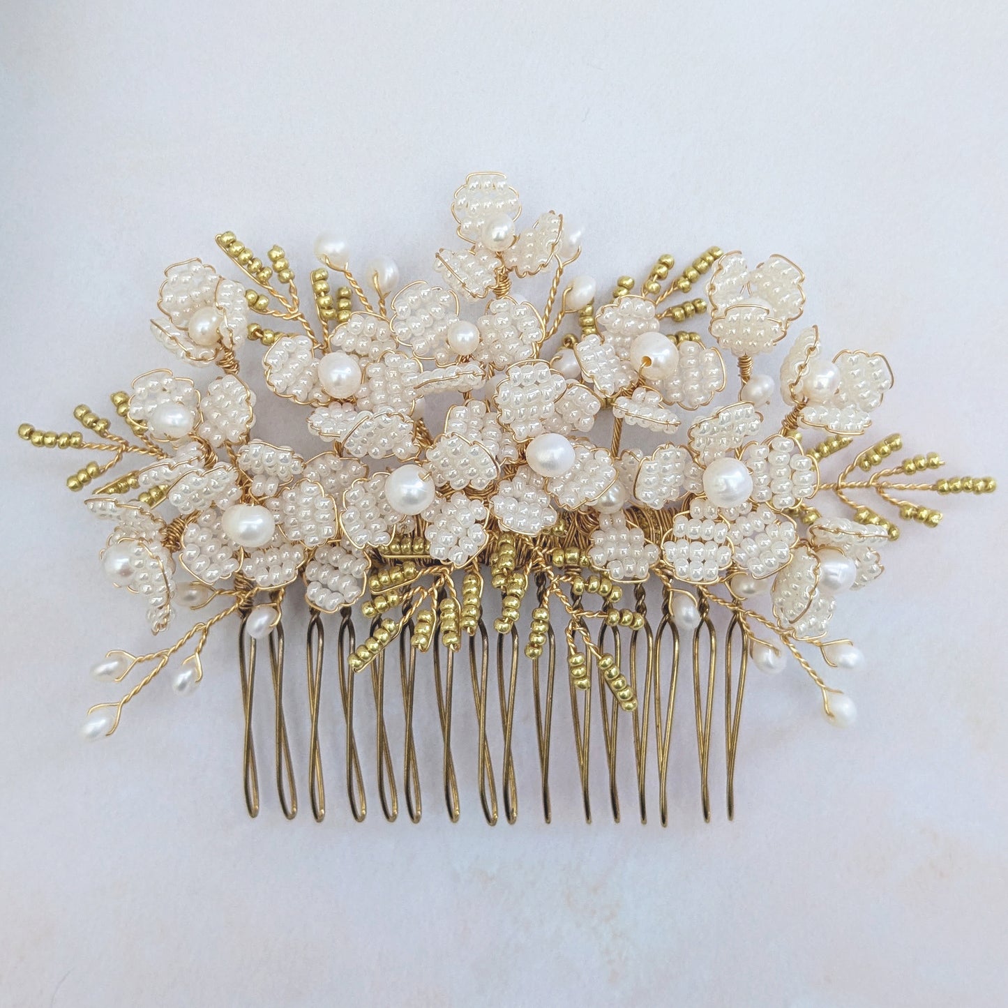 Botanical hair comb with pearl flowers for brides designed & handmade by Susie Warner.