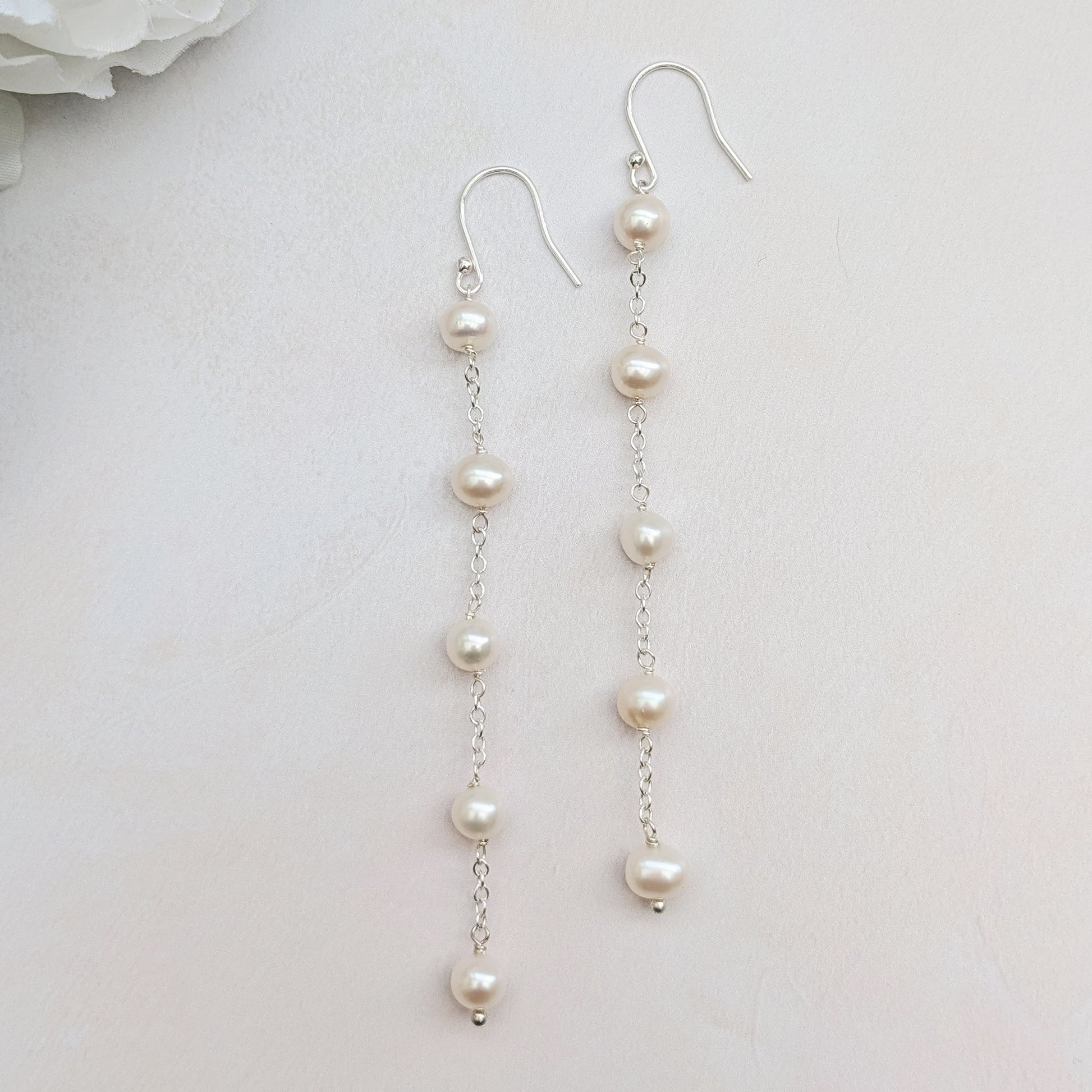 Statement pearl stationed drop earrings for brides designed & handmade by Susie Warner.
