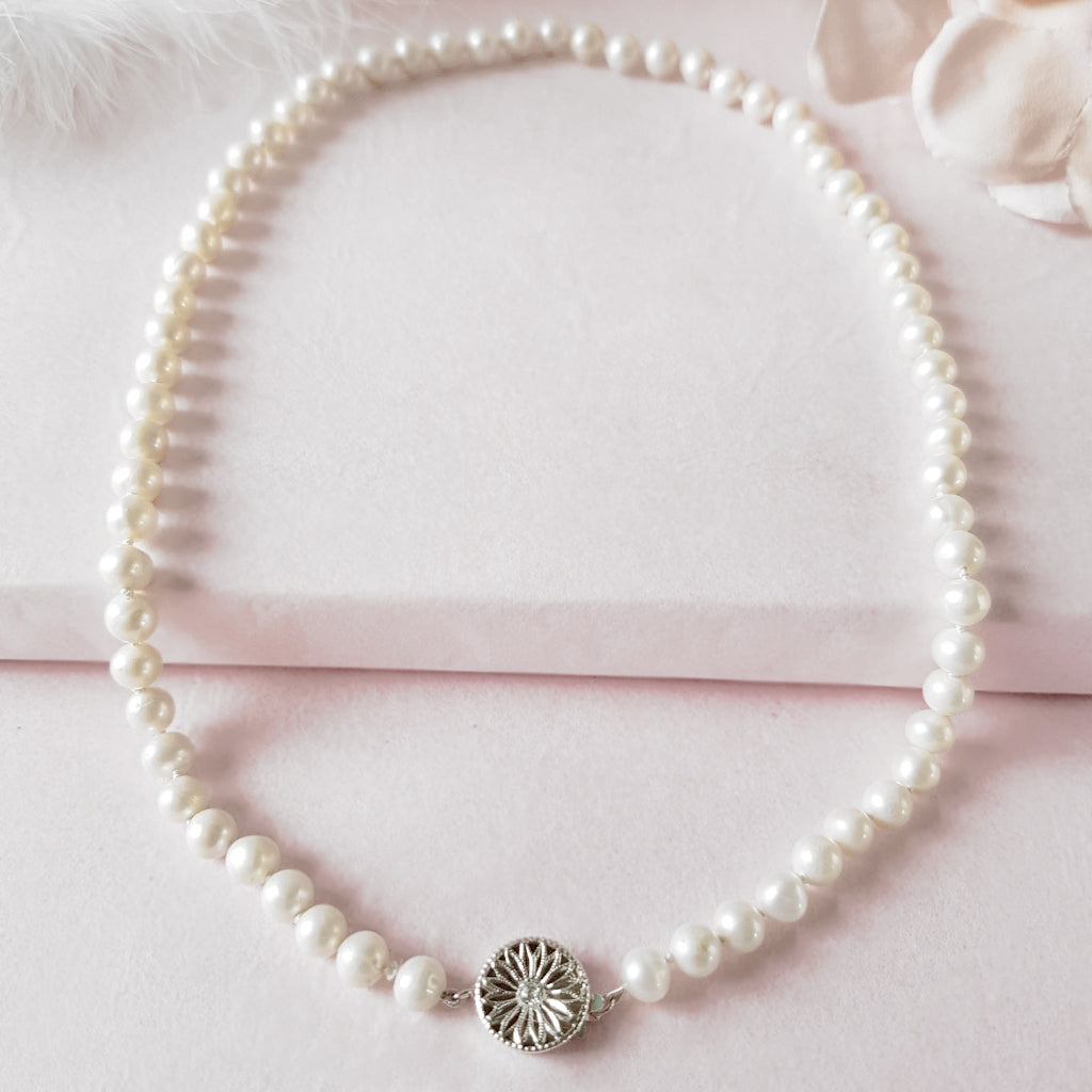 Pearl necklace with decorative Silver & CZ clasp designed & handmade by 
 Susie Warner.